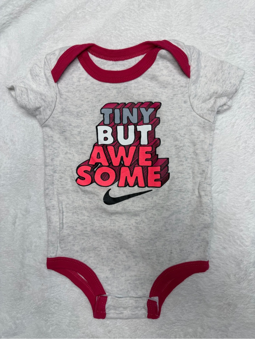 Nike Gray Baby One-Piece with Pink Trim and 'Tiny But Awesome' Graphic